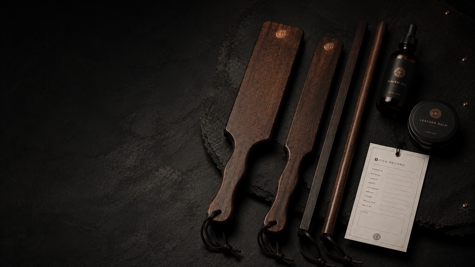 Sub Space Boutique wooden discipline tools arranged in a private black and copper chamber