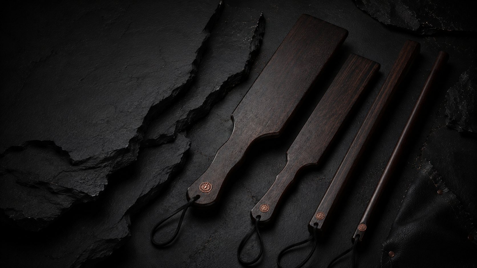 Sub Space Boutique wooden discipline tools arranged in a private black and copper chamber