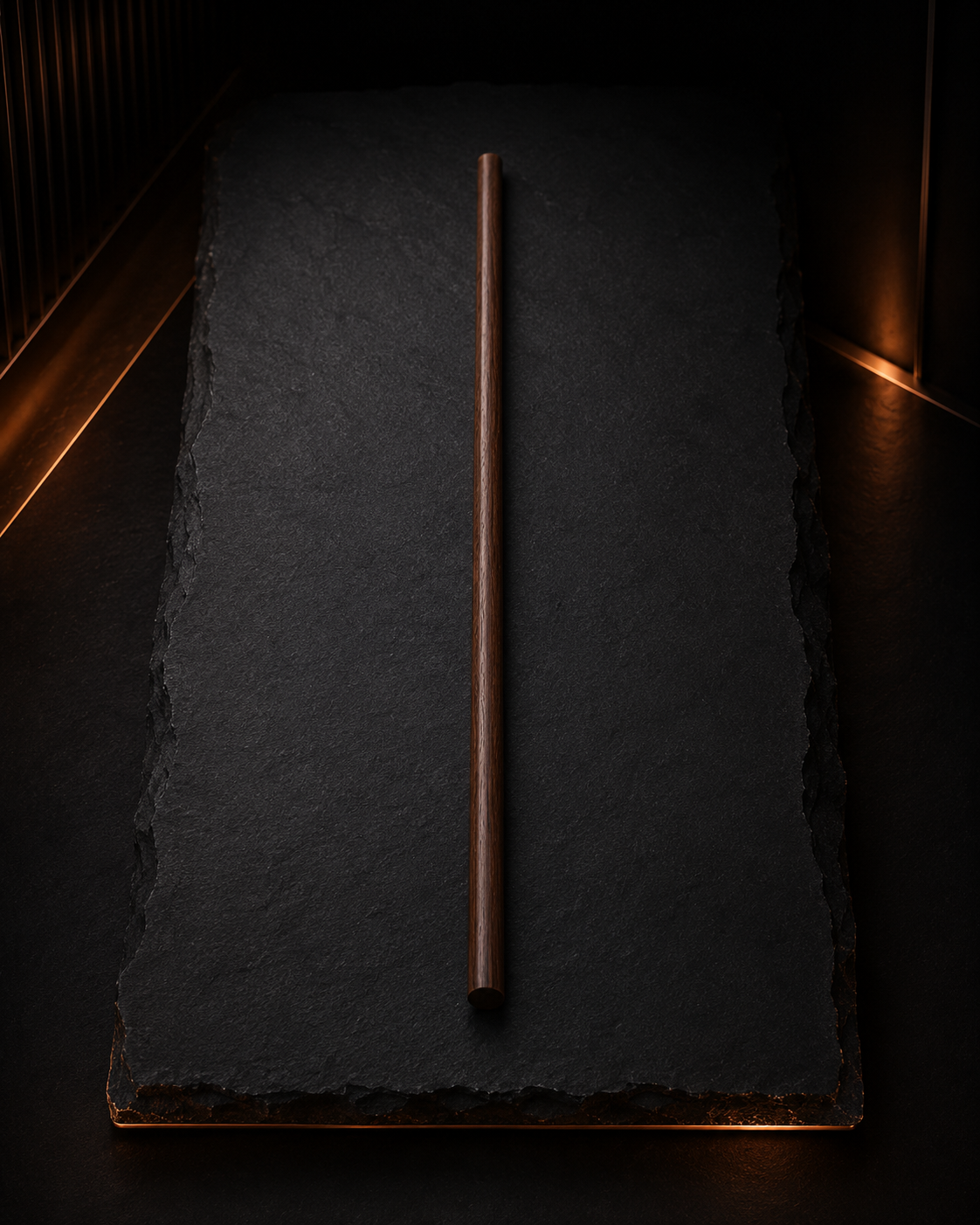 Straight wooden course correction cane on a blackened wood surface